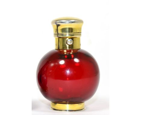 A Late Victorian Gilt White Metal Ruby Glass Scent Bottle, of ovoid form with hinged cover and mirrored base, stamped S Morda