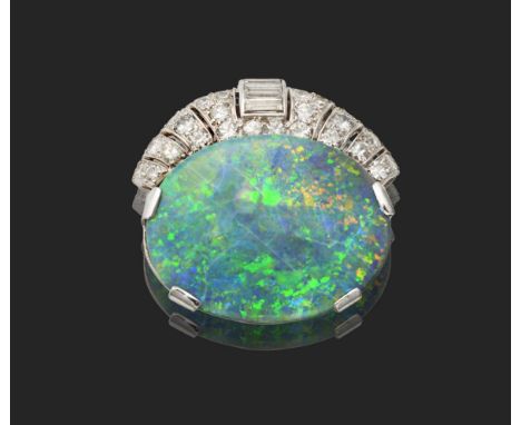 An Art Deco Black Opal and Diamond Clip Brooch, Signed 'Cartier London', an oval cabochon opal in a claw setting, beneath a r