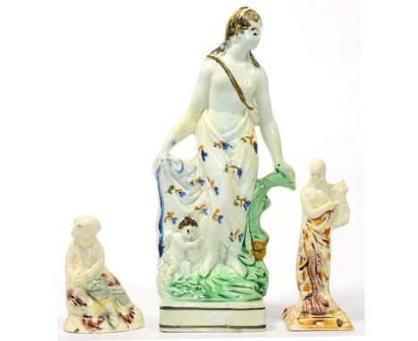 A Prattware Figure of Venus and Cupid, circa 1790, the standing goddess with her hand on a dolphin, on a square base, 21cm hi
