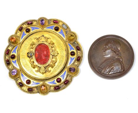 A Gilt Metal Buckle, dated 1854, of lobed circular form, set with a central carnelian cameo, garnet cabochons, amethysts and 