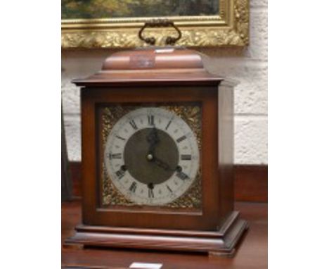 A GEORGIAN STYLE CHIMING BRACKET CLOCK, the circular chapter ring, with Roman and Arabic numerals, within brass spandrels, 13