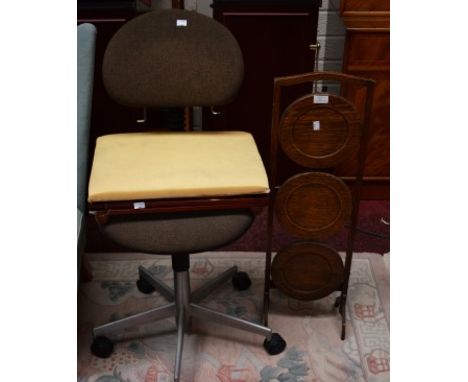 A THREE TIER CIRCULAR FOLDING CAKE STAND, together with a modern office chair and a folding gout stool. (3) 