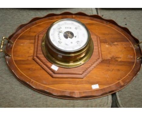 A BRASS SHIPS BAROMETER, by Foster Callear, in inches and milibars, on an octagonal moulded wooden panel; together with an ov