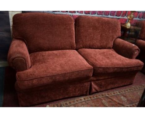 A TWO SEATER EASY SETTEE, with cushion back and seat; together with a matching easy armchair, covered in red rust fabric. (1)