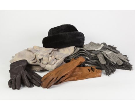 A TWO TONE FAWN CASHMERE SCARF; A WIDE AND LONG GREY WOVEN WOOL SCARF with grey striped borders and a PAIR OF MATCHING GLOVES