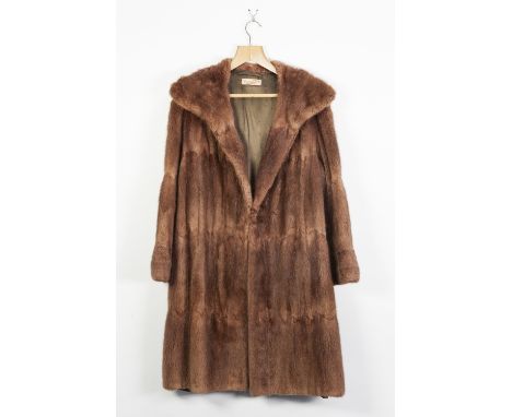A FRAN KLINS TAN BROWN RABBIT 3/4 FUR COAT, fold over collar, front deam pockets. hook eye fastening, a ELLIS BAKER CREAM FUR