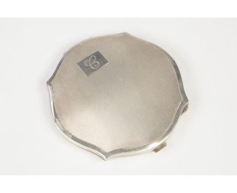 SILVER SHAPED CIRCULAR POWDER COMPACT, with engine turned decoration, interior mirror, Birmingham 1939, 1.88oz gross 
