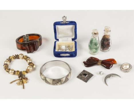 BROWN PLASTIC BOW PATTERN SPRING HINGED BANGLE and bow BROOCH; bead BRACELET; metal crescent moon BROOCH; tow bottles of semi