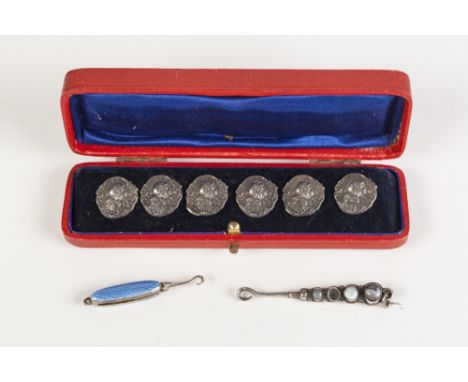 CASED SET OF SIX ART NOUVEAU CAST SILVER CIRCULAR BUTTONS, featuring head of a maiden wearing a garland of flowers, stamped  
