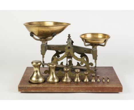 A. STEVENS, LONDON, PAIR OF EARLY TWENTIETH CENTURY PROVISIONS/SHOP SCALES, with brass pans on mahogany base, cut out to rece