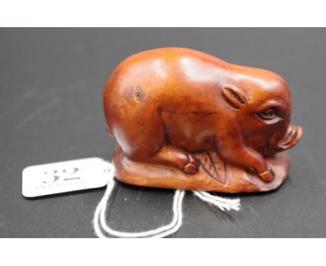 Japanese carved wood pig netsuke signature to base, 6.5cm length approx.