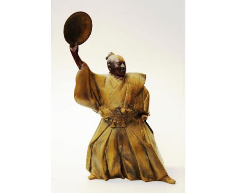 Vintage Japanese bronzed warrior figure standing robed figure of a Japanese warrior, holding a shield aloft, (possibly with l