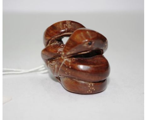 Japanese carved wood snake netsuke signature to back, 3cm height approx