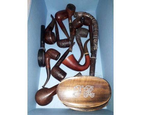 A box containing 11 briar pipes, an opium pipe stem with white metal banding, a pair of vintage monogrammed clothes brushes e