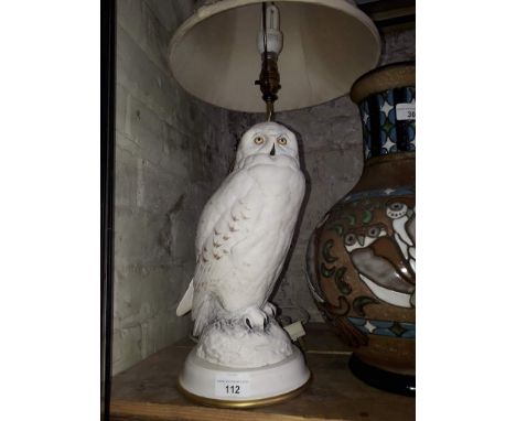 A Franklin Mint porcelain table lamp modelled as a snowy owl, by Raymond Watson  