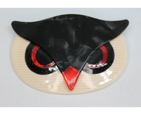 A vintage plastic brooch modelled as an owl by Lea Stein, length 6cm.After inspection this vintage plastic brooch is signed L