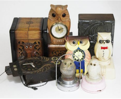 A quantity of vintage owl ornaments comprising a cigarette box, two wooden clocks, a plastic clock, a peweter covered box, tw