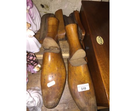 A pair of vintage hinged wooden shoe lasts.  