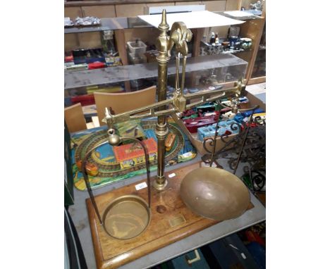 A set of vintage brass chemists scales on wooden base with plaque inscribed 'Crooks Chemist'.  