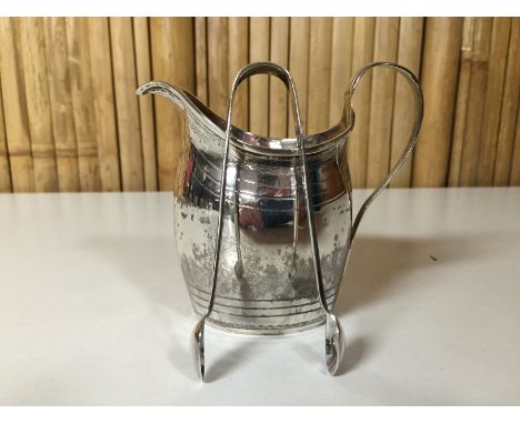 A HELMET SHAPED SILVER CREAM JUG, LONDON 1800, ALONG WITH  20TH CENTURY SILVER SUGAR NIPS 