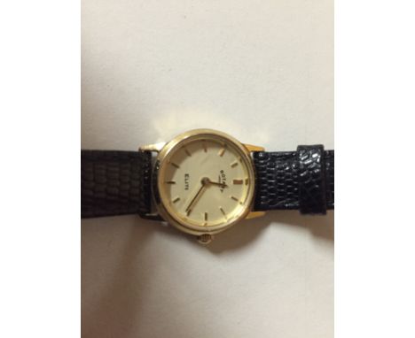 A LADY'S 9CT GOLD ROTARY ELITE WRIST-WATCH WITH LEATHER STRAP 