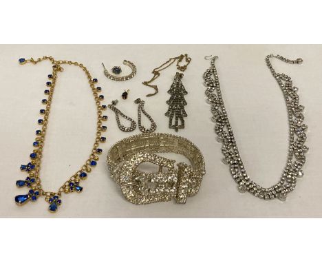 A collection of vintage diamante jewellery to include a buckle bracelet.  Also includes necklaces and drop earrings. 