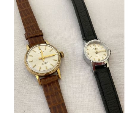 2 ladies vintage wristwatches. An Excalibur with white dial and gold tone hands and hour markers.  Together with a Bentima wi