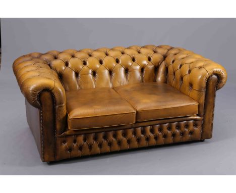 A CHESTERFIELD BUTTON BACK SOFA, upholstered in olive green leather. 158cm