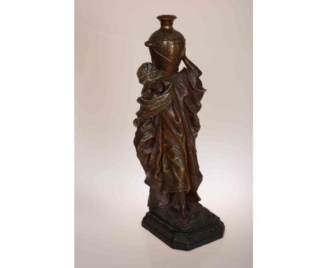 A LARGE GERMAN POLYCHROME DECORATED TERRACOTTA FIGURE, early 20th Century, modelled as a Moorish water carrier, drilled as a 