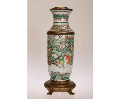 A CHINESE PORCELAIN AND METAL MOUNTED LAMP BASE, the lamp decorated in famille verte enamels with warriors on horseback among