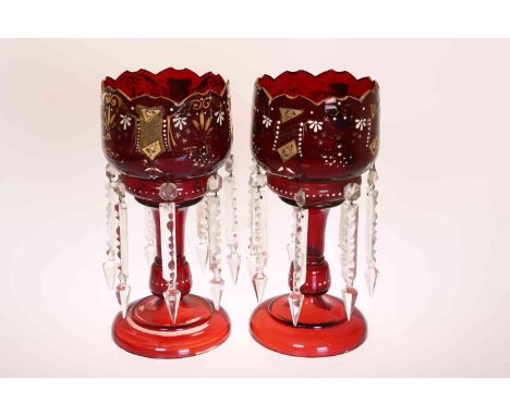 A PAIR OF VICTORIAN CRANBERRY GLASS LUSTRES, the bowls decorated with gilt and enamel decoration and each with seven clear cu
