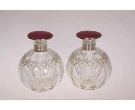 A PAIR OF GEORGE V SILVER AND ENAMEL SCENT BOTTLES, Adie Bros, Birmingham 1923, each with engine turned fuchsia pink enamel h