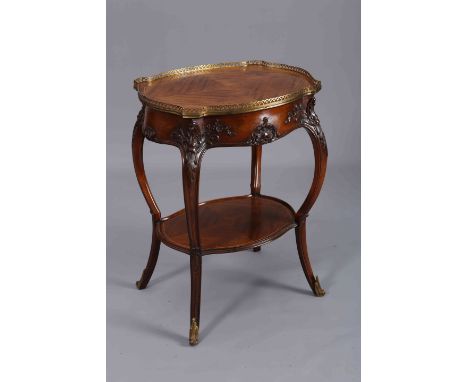 A FRENCH WALNUT OCCASIONAL TABLE IN LOUIS XV STYLE, the quarter veneered shaped oval top with pierced brass gallery, raised o