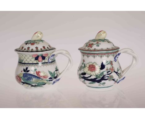 A PAIR OF ROYAL WORCESTER CUSTARD POTS AND COVERS, CIRCA 1900, with fruit pod finials and twisted handles decorated throughou