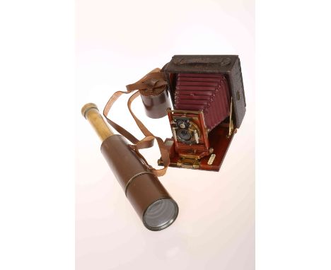 A ROCHESTER OPTICAL COMPANY PONY PREMO NO. 5 FOLDING CAMERA; together with A BROADHURST CLARKSON & CO LTD SIX DRAWER BRASS TE