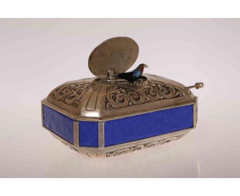 A CONTINENTAL SILVER AND BLUE ENAMEL SINGING BIRD BOX, of rectangular cushion shape with canted corners and blue enamel panel