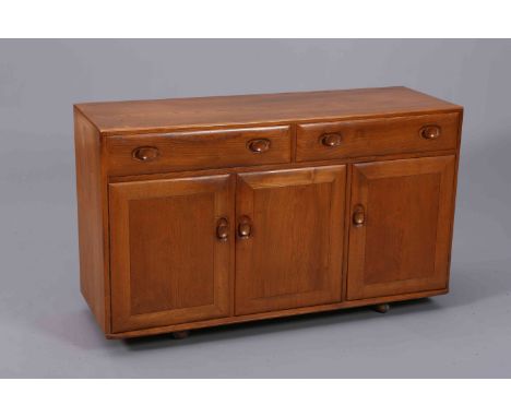 AN ERCOL WINDSOR GOLDEN DAWN ELM SIDEBOARD, with a pair of drawers over three cupboard doors, moving on castors. 80.5cm by 13