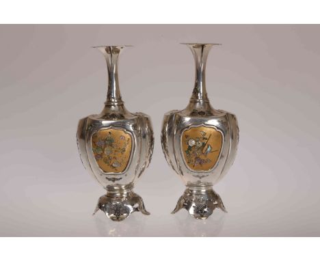 A PAIR OF LATE 19TH CENTURY JAPANESE SHIBAYAMA, ENAMEL AND SILVER VASES, with petal shaped rims above a slender neck, bulbous