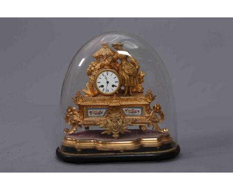 A FRENCH 19TH CENTURY GILT METAL MANTEL CLOCK, mounted with the figure of a lady standing beside a drum shaped clock case enc