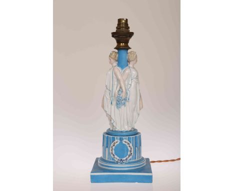 A CONTINENTAL 19TH CENTURY PORCELAIN FIGURAL TABLE LAMP, with underglaze blue crossed swords mark. 38cm high