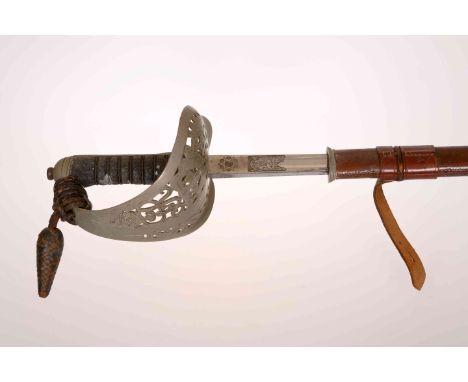 A GEORGE V ARMY OFFICERS DRESS SWORD, with pierced basket, 32½ inch etched blade, in brown leather scabbard.