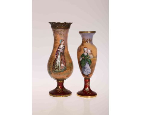 TWO CONTINENTAL ENAMEL AND GILT METAL VASES, decorated with female courtiers in a landscape, on red enamel and gilt circular 