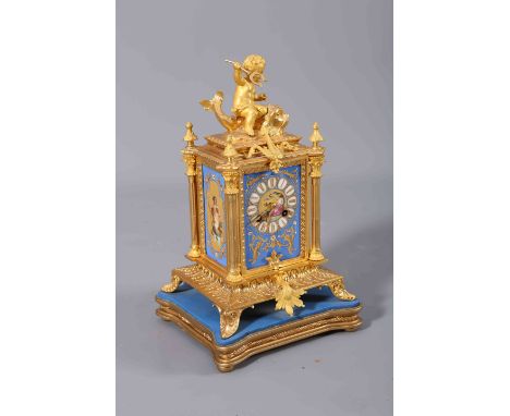 A FINE FRENCH 19TH CENTURY ORMOLU AND PORCELAIN MOUNTED MANTEL CLOCK, the rectangular case surmounted by a putto riding a fis