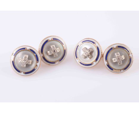 A PAIR OF MOTHER OF PEARL, ENAMEL AND DIAMOND CUFFLINKS, CIRCA 1900, each slightly domed circular plaque set with a cross des