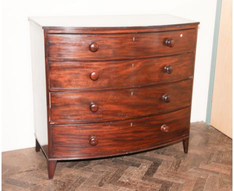 46" wide late Georgian mahogany bow front chest of 4 long drawers with Victorian style bun handles