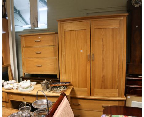 Modern light oak bedroom suite comprising of bow front wardrobe with 2 long drawers under, a bow front chest of 3 drawers, a 