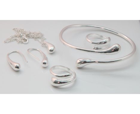 Modern sterling silver earrings, dress ring, torque bangle and pendant - all set with tear shaped droppers 