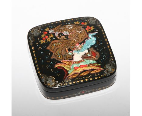 Russian lacquer trinket box in the tradition of Cholui; the hinged lid decorated with a male figure and a fire bird - measure