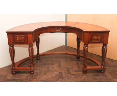 Good quality reproduction mahogany semi circular shaped desk with fitted drawer and cupboards with brown leather tops standin