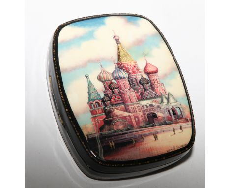 Russian lacquer trinket box; the lid decorated with a view of the Kremlin, inscription to base - measures 12.5cm by 10cm  Goo